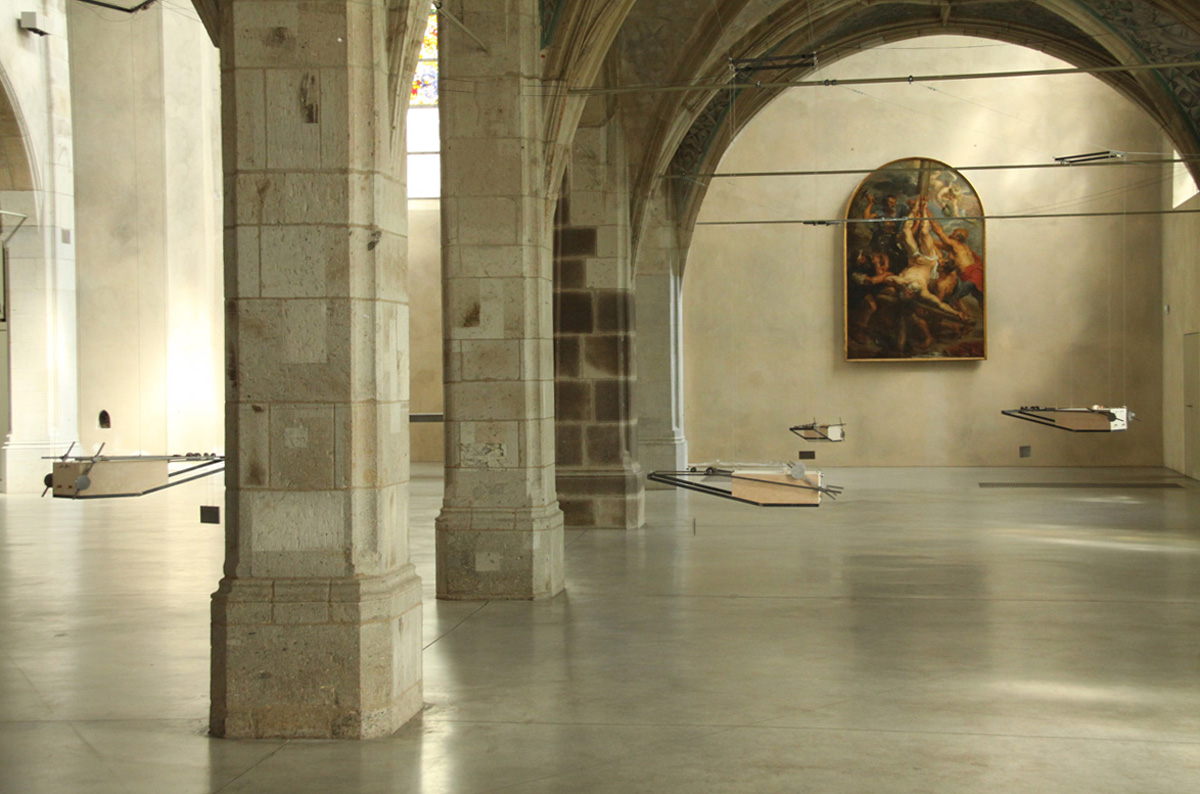 An image of the five hurdy gurdy sculptures hanging from the ceiling.