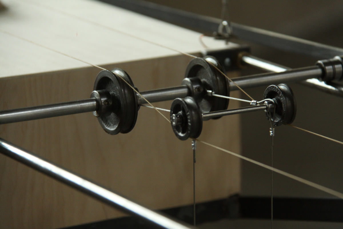 An image of the five hurdy gurdy sculptures hanging from the ceiling.