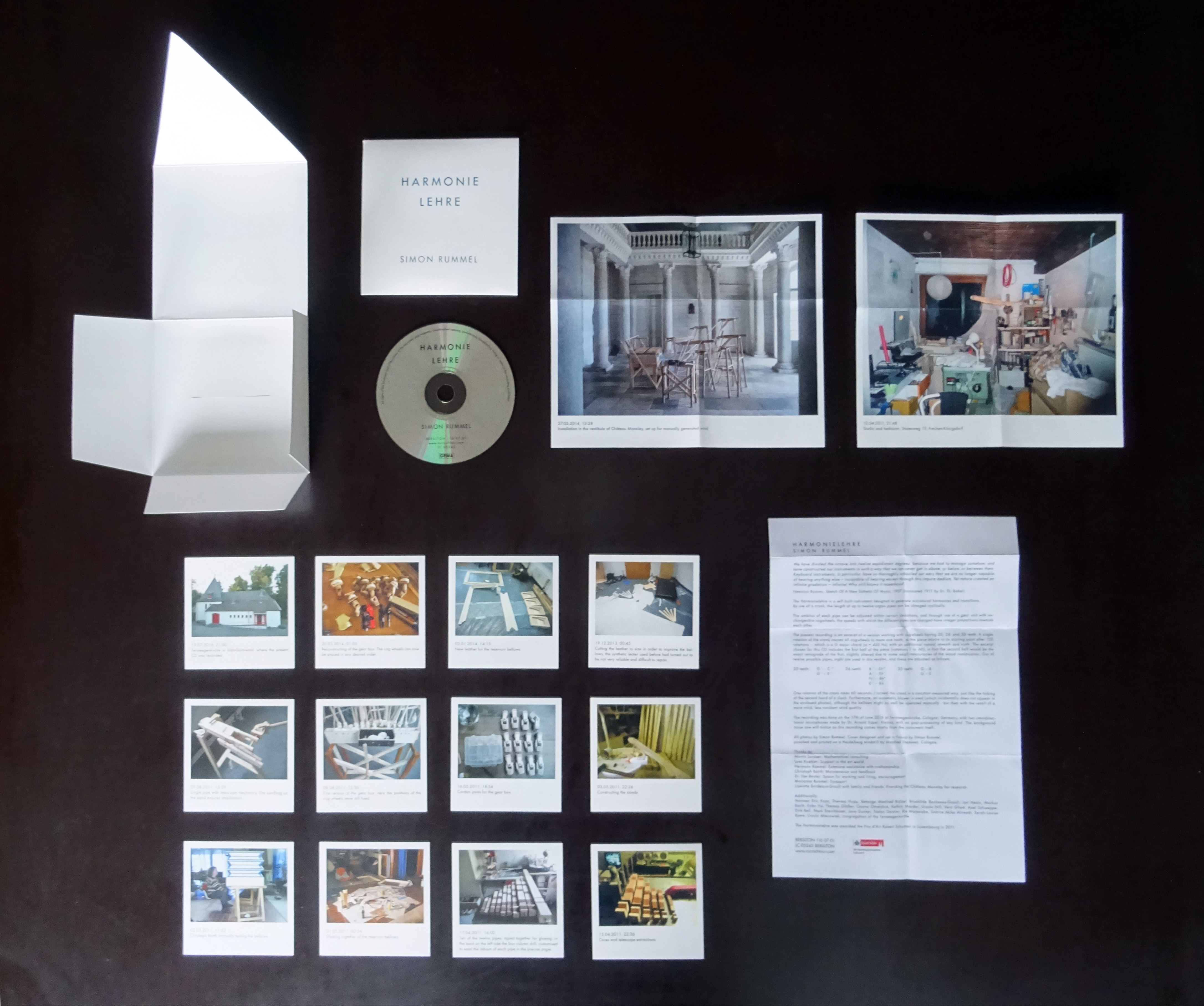 A photo of the unfolded CD Harmonielehre with all the Photos and the CD which are inside.