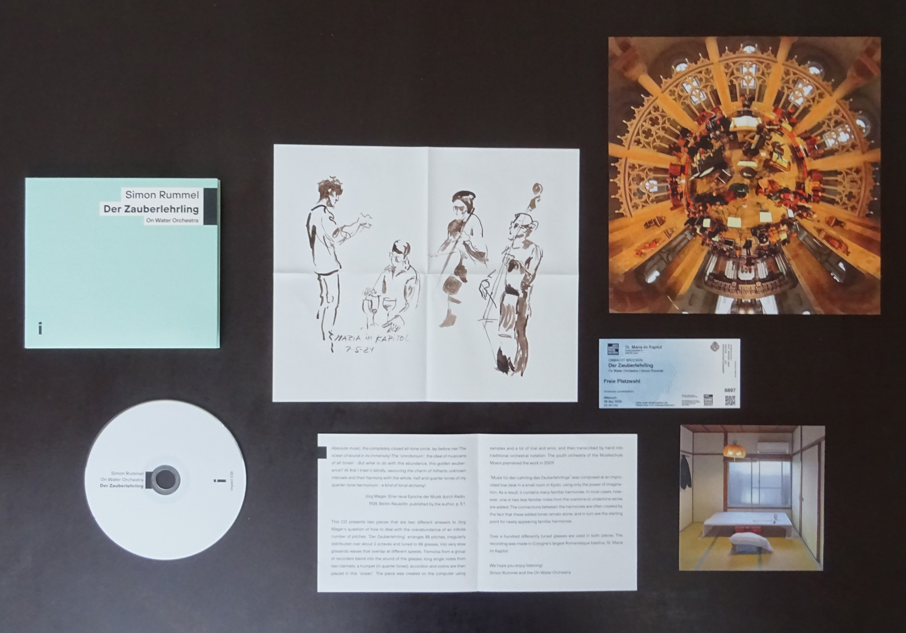 A photo of the unfolded CD Der Zauberlehrling with all the Photos and the CD which are inside.